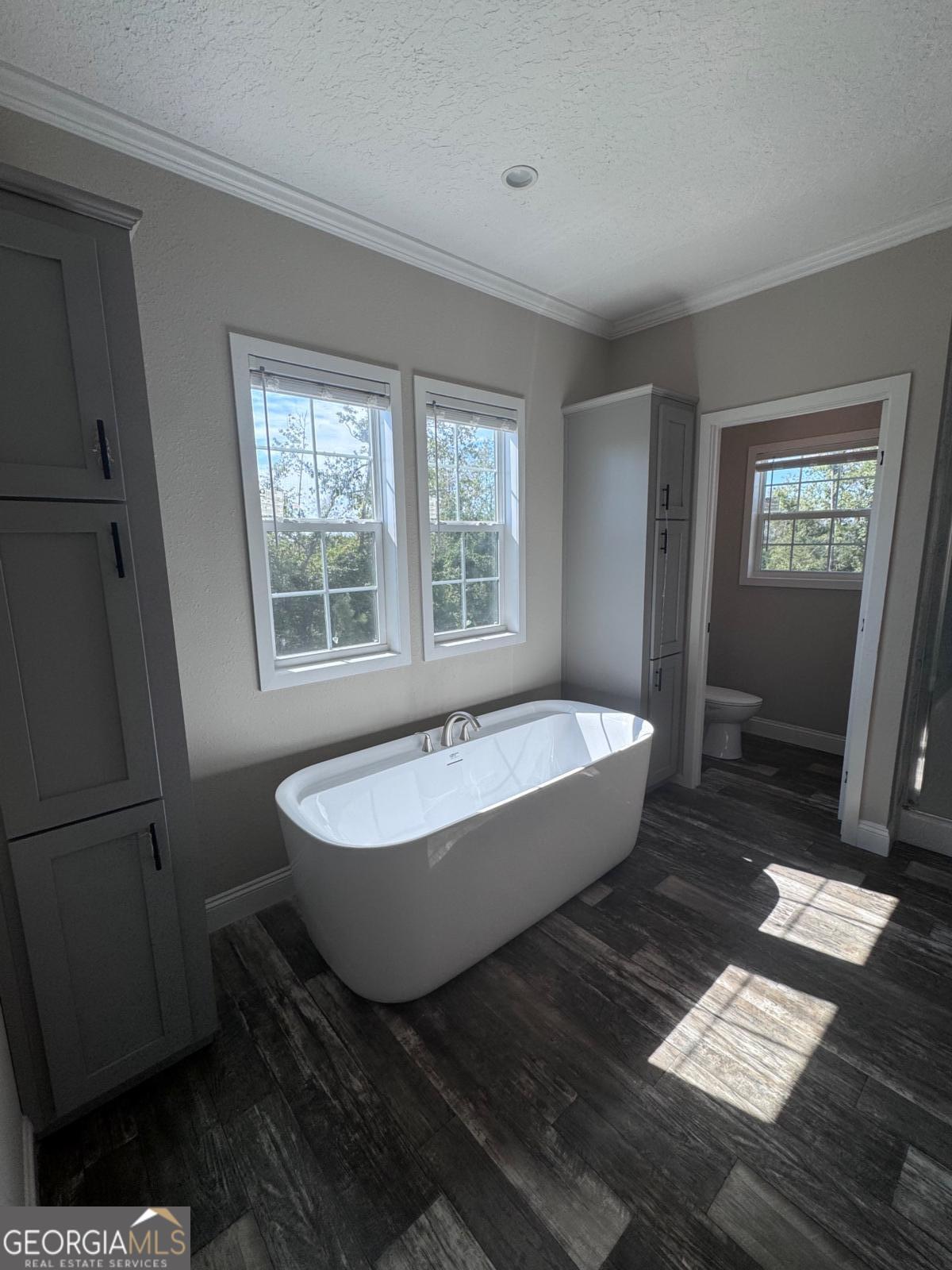 44 Long Leaf Road Hazlehurst, GA 31539 - Photo 7 of 21 a bathroom with a bathtub and a shower
