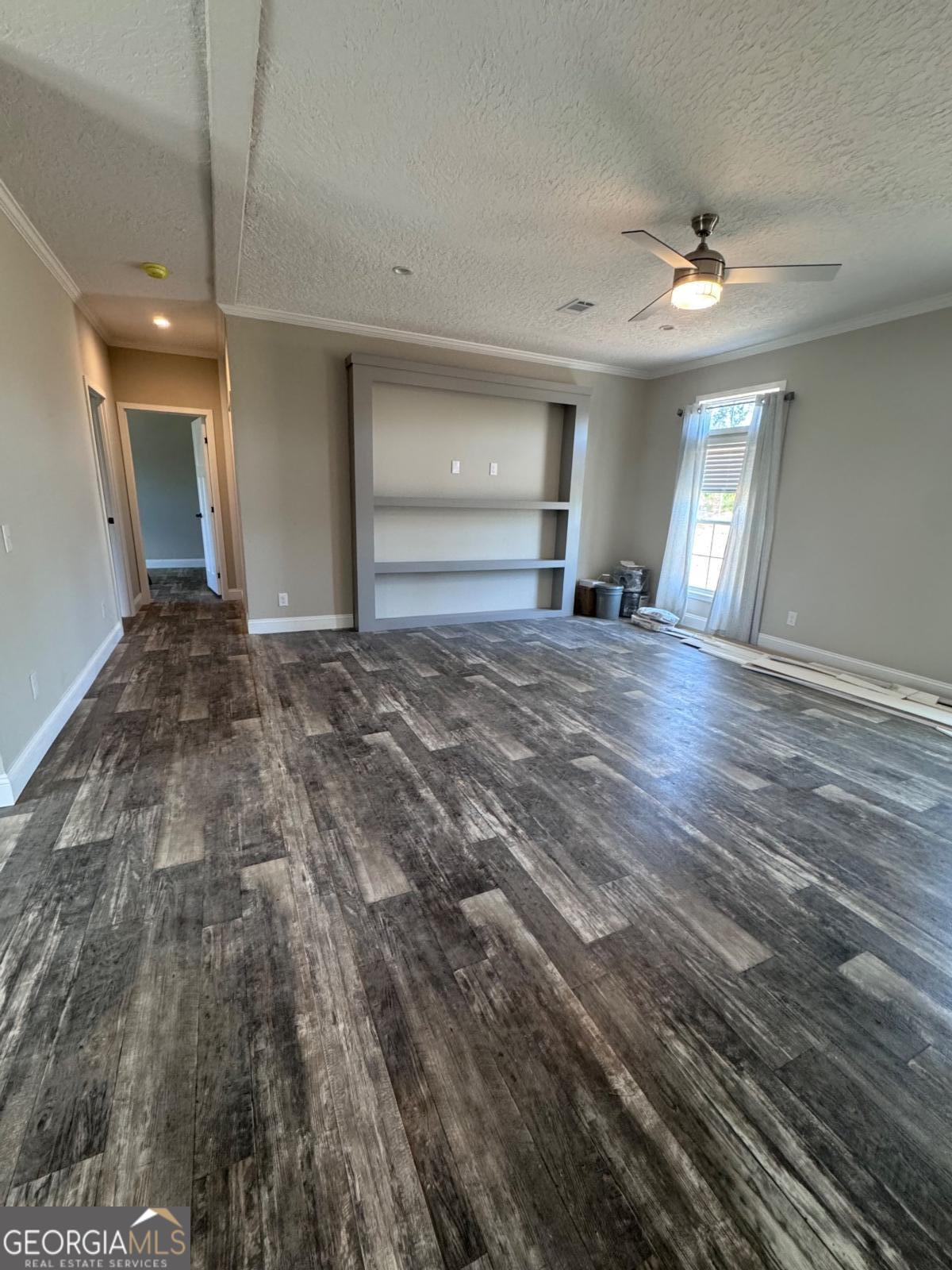 44 Long Leaf Road Hazlehurst, GA 31539 - Photo 8 of 21 a view of a livingroom with wooden floor and window