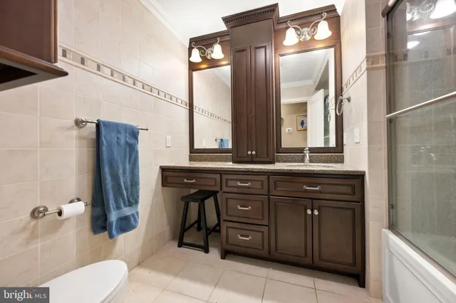 a bed room with a bed and a mirror