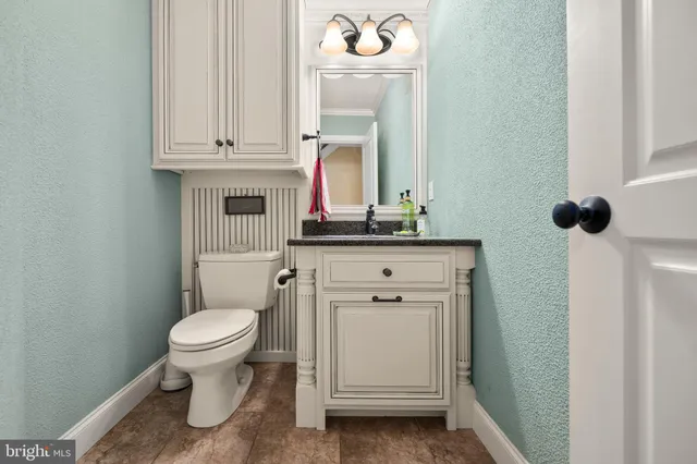 a view of a hallway with staircase