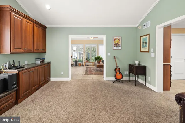 a view of a livingroom with lounge chair and a window