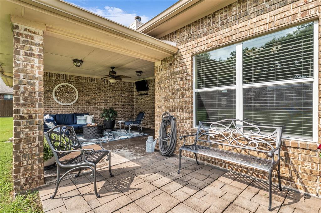 910 Springdale Lane Lorena, TX 76655 - Photo 29 of 39 Covered patio featuring brick columns, recessed lighting, and a ceiling fan