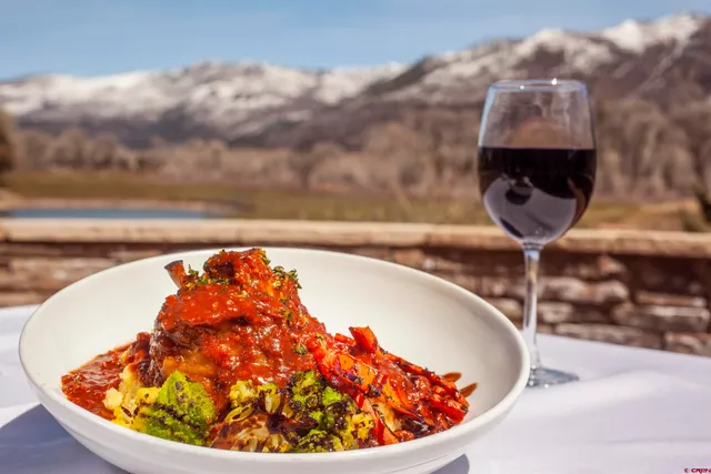 a view of a town with mountains in the background