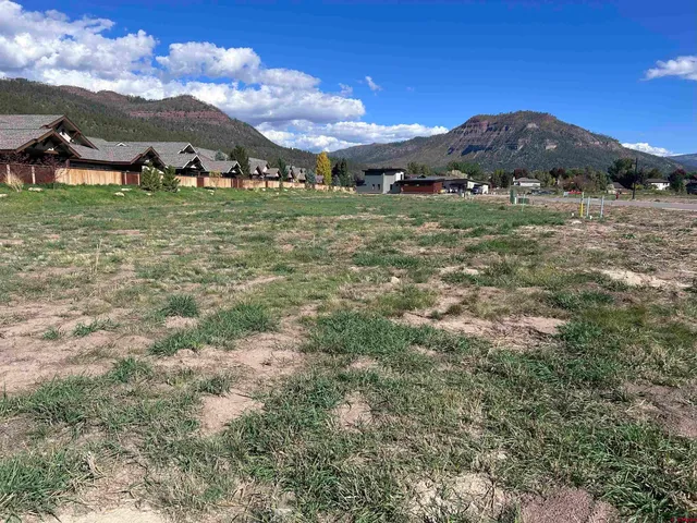 a bathroom with a mirror and a shower curtain