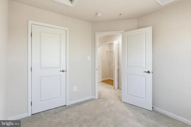 an empty room with closet area