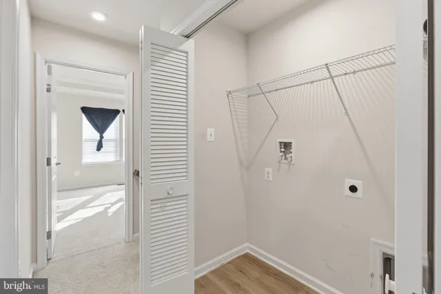 a view of a bathroom from a hallway