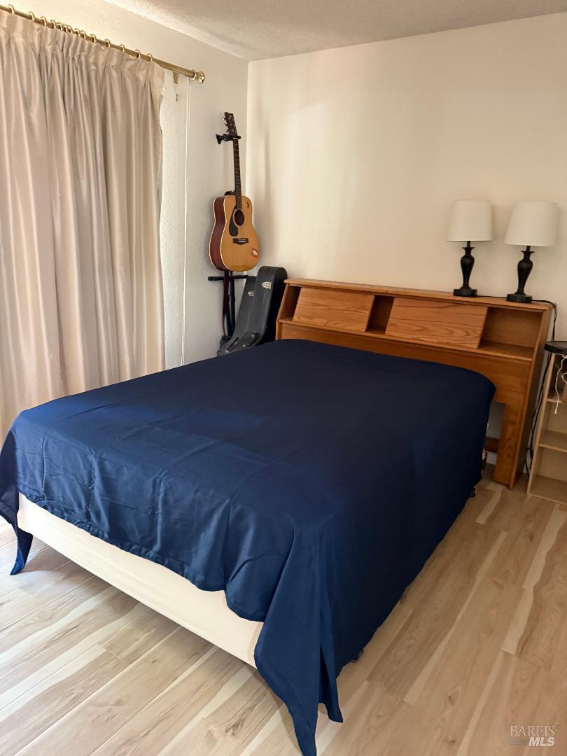 31300 Sherwood Road Willits, CA 95490 - Photo 13 of 29 a bedroom with a bed and a table in it