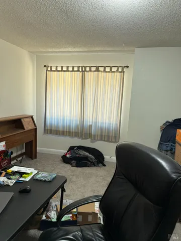 a room with furniture and window