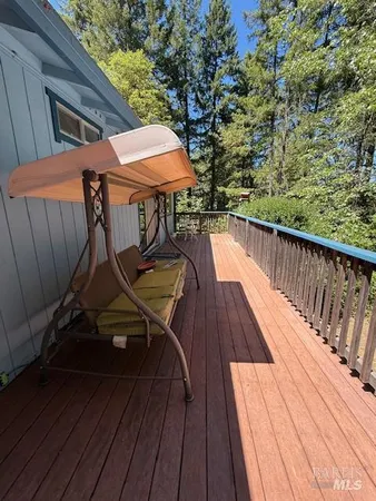 a view of deck with wooden floor and outdoor seating