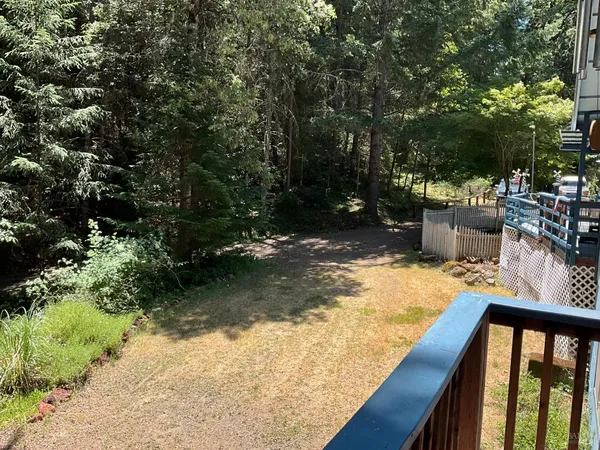 a view of swimming pool from a backyard
