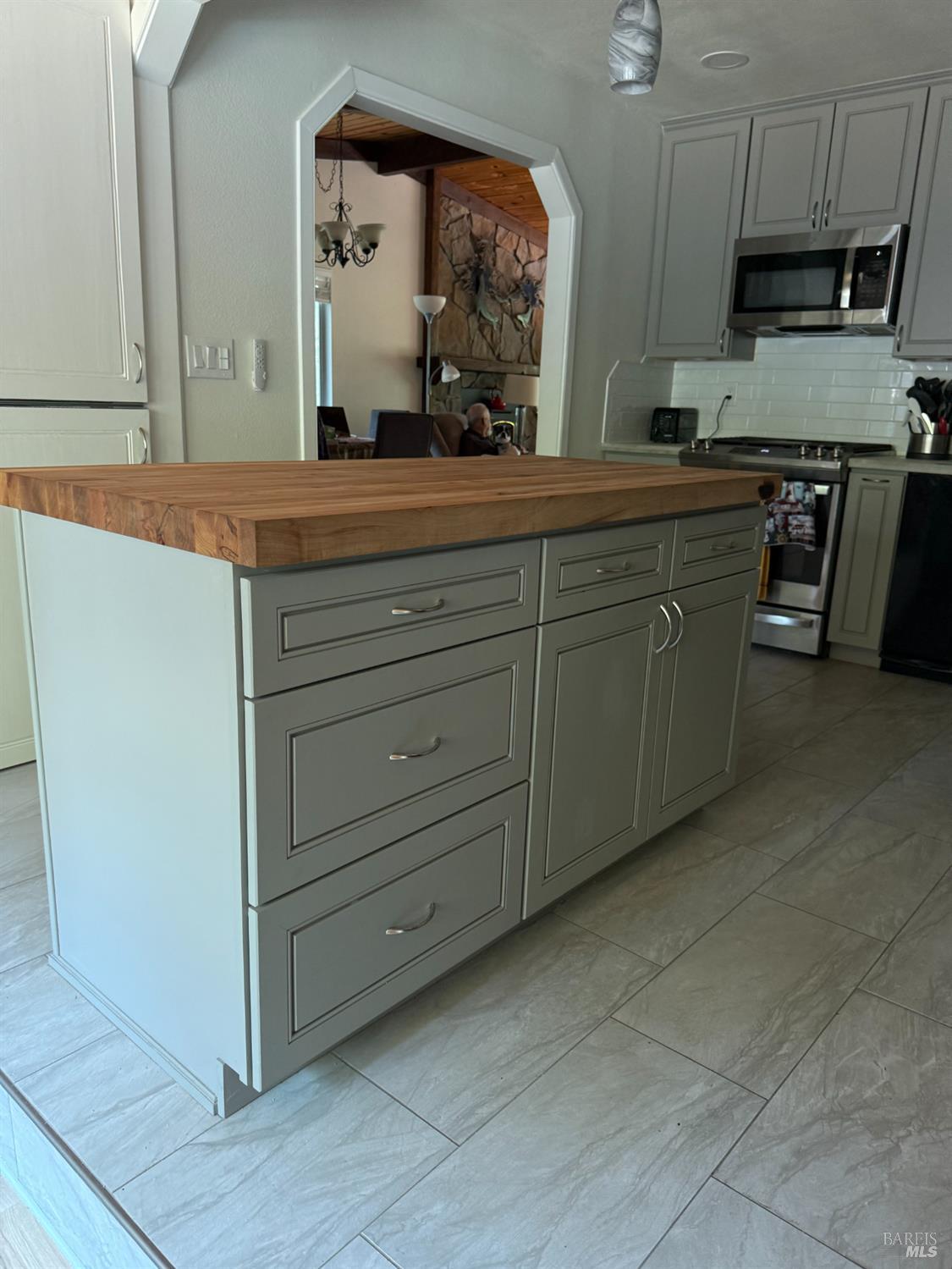 31300 Sherwood Road Willits, CA 95490 - Photo 6 of 29 a spacious bathroom with a granite countertop sink and a mirror