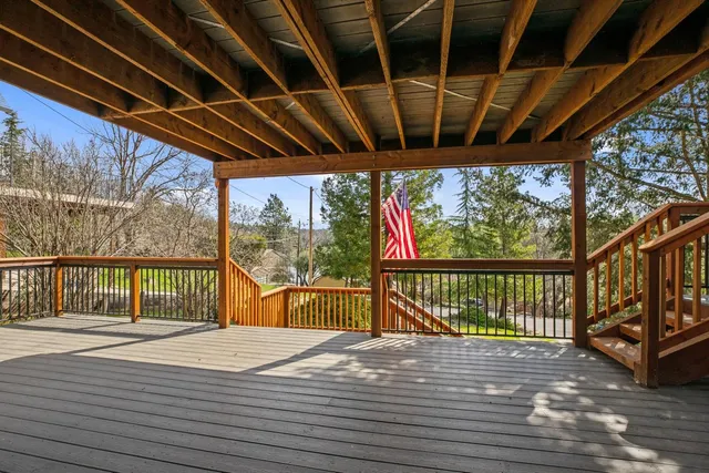 a view of balcony with wooden floor