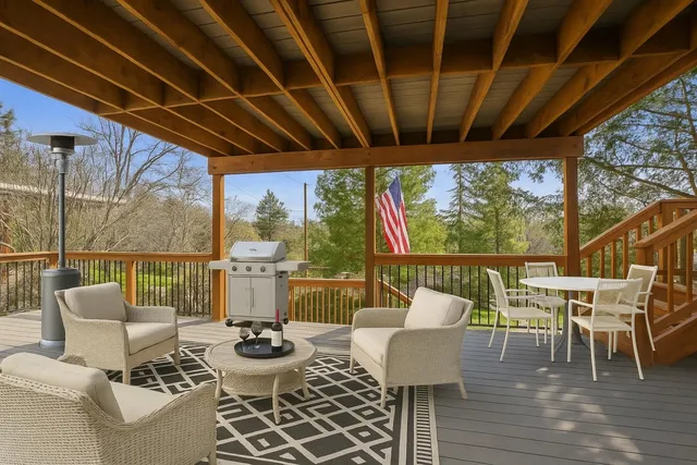 a view of a patio with couches chairs and potted plants