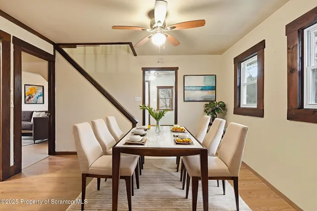 a view of a hallway with windows and entryway