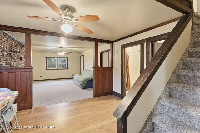 a view of kitchen with furniture and wooden floor