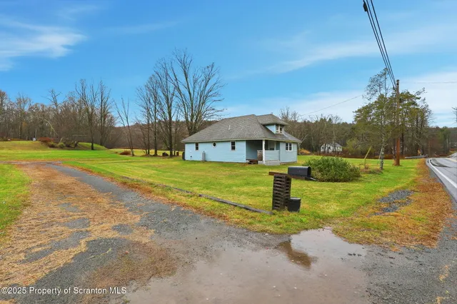a house view with a garden space