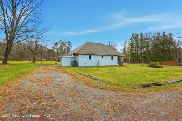 a view of a house with a big yard