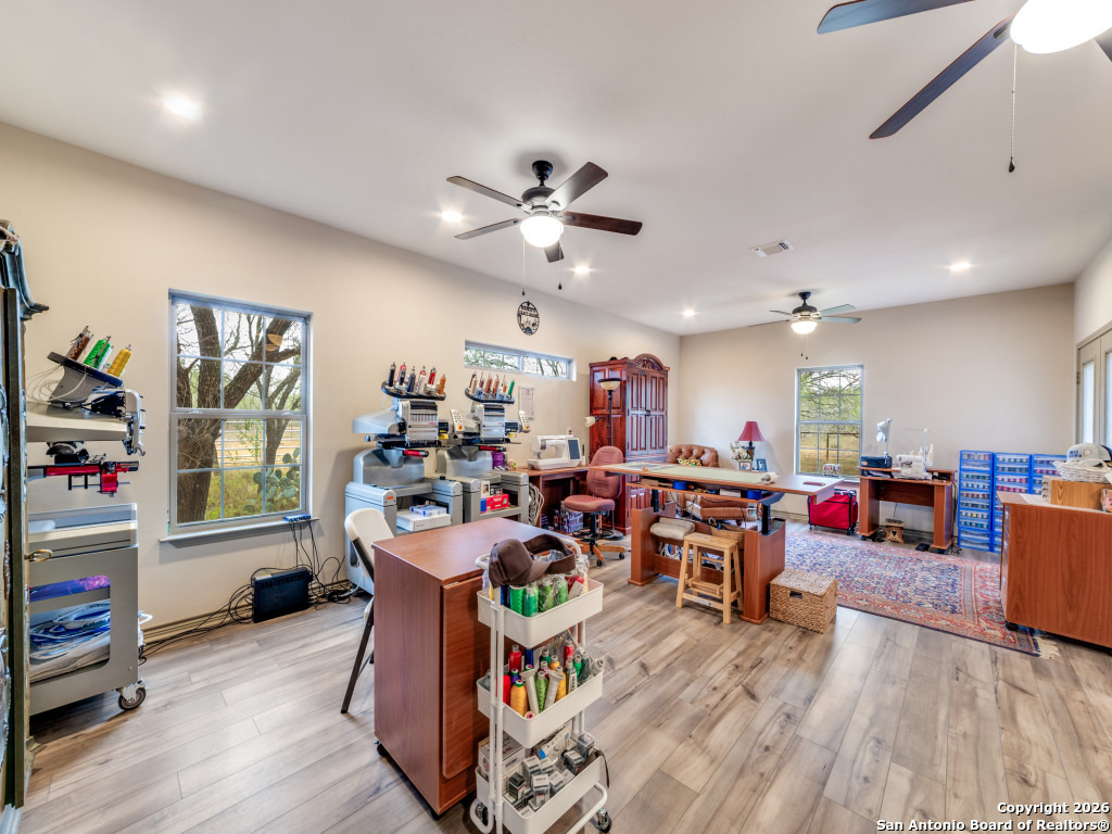 6472 Bluntzer Road Jourdanton, TX 78026 - Photo 12 of 45 a living room with furniture and a wooden floor
