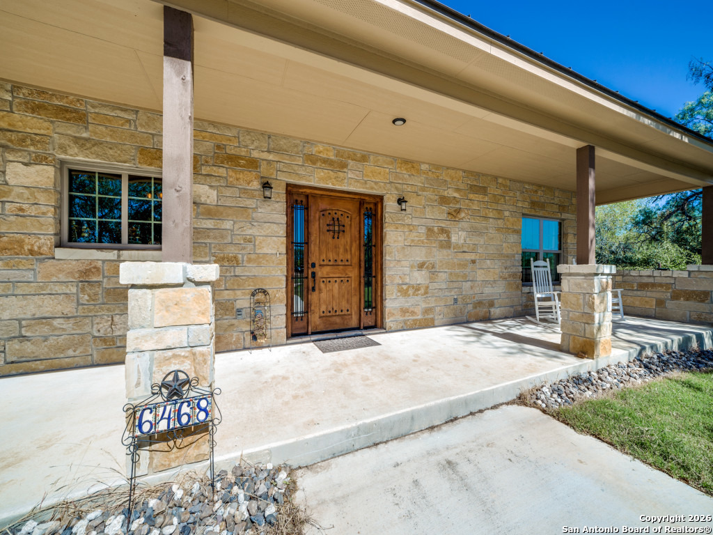 6472 Bluntzer Road Jourdanton, TX 78026 - Photo 2 of 45 a backyard of a house with seating space