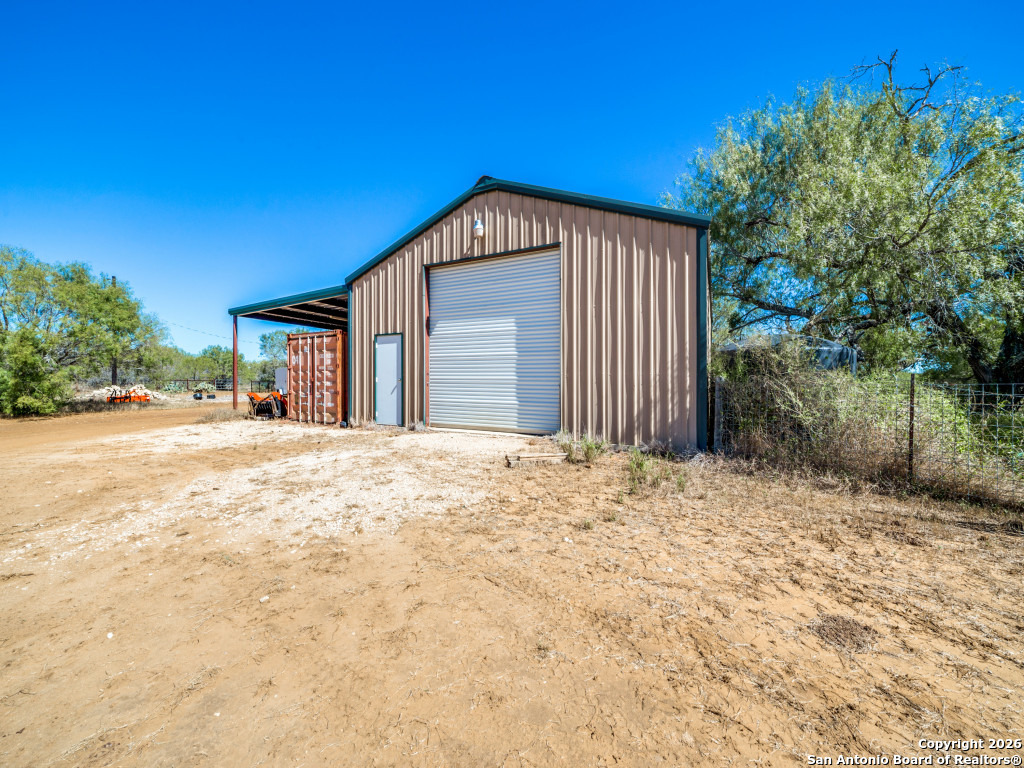 6472 Bluntzer Road Jourdanton, TX 78026 - Photo 27 of 45 a view of backyard of house