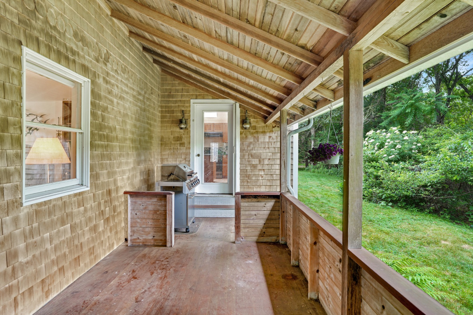 174 Middle Road Chilmark, MA 02535 - Photo 28 of 40 a porch with a table and chairs