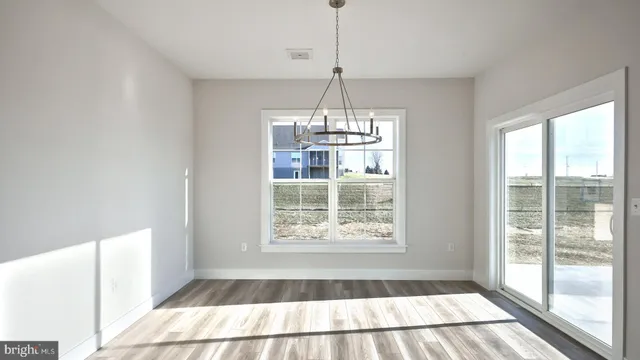 a large kitchen with kitchen island a sink stainless steel appliances and cabinets