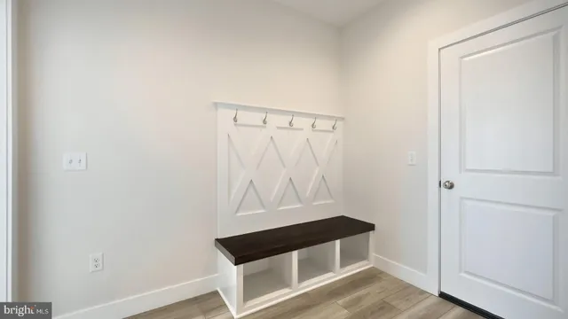 a open kitchen with cabinets stainless steel appliances and wooden floor