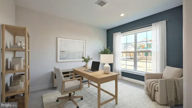 a work room with furniture and windows
