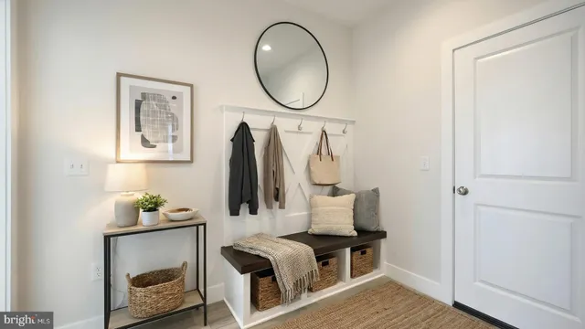 a view of an entryway with wooden floor