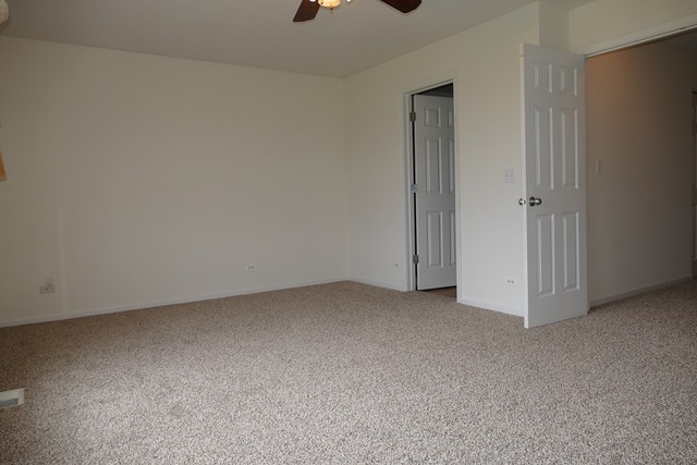 287 Springbrook Trail South Oswego, IL 60543 - Photo 6 of 14 a view of an empty room and a window