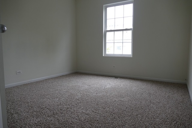 287 Springbrook Trail South Oswego, IL 60543 - Photo 10 of 14 an empty room with a window