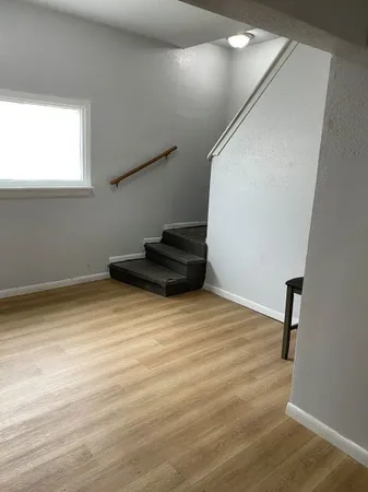 a kitchen with a refrigerator and a stove