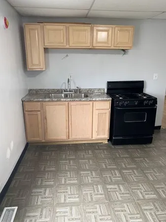 a bathroom with a mirror sink and vanity