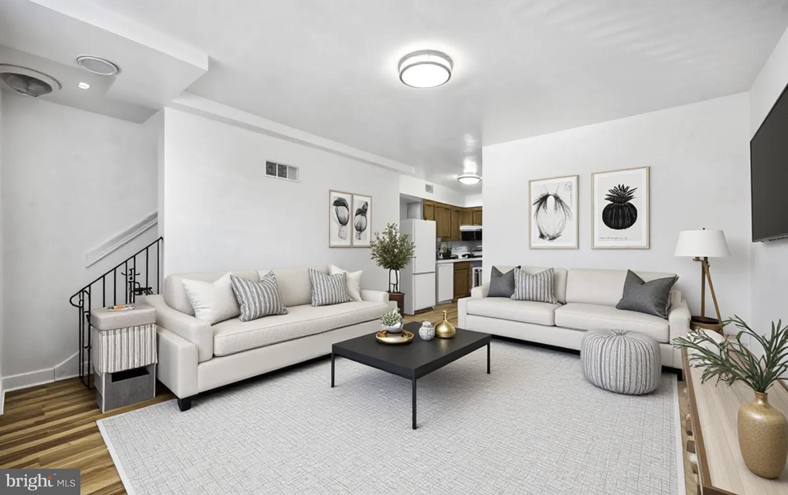 2206 15th Street Northeast Washington, DC 20018 - Photo 1 of 11 a living room with furniture and a view of bathroom