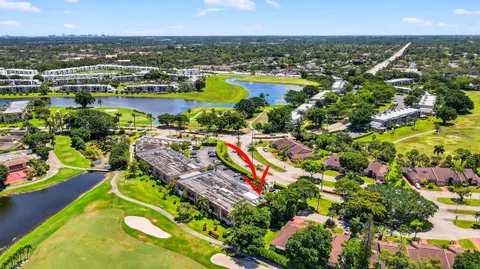 an outdoor space with swimming pool and furniture