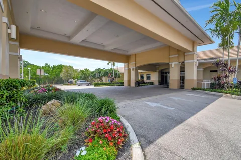 a view of a room with gym equipment and a projector screen