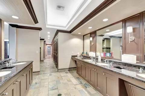 a view of hallway with furniture and wooden floor