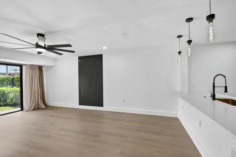 a view of a kitchen with a sink and a window