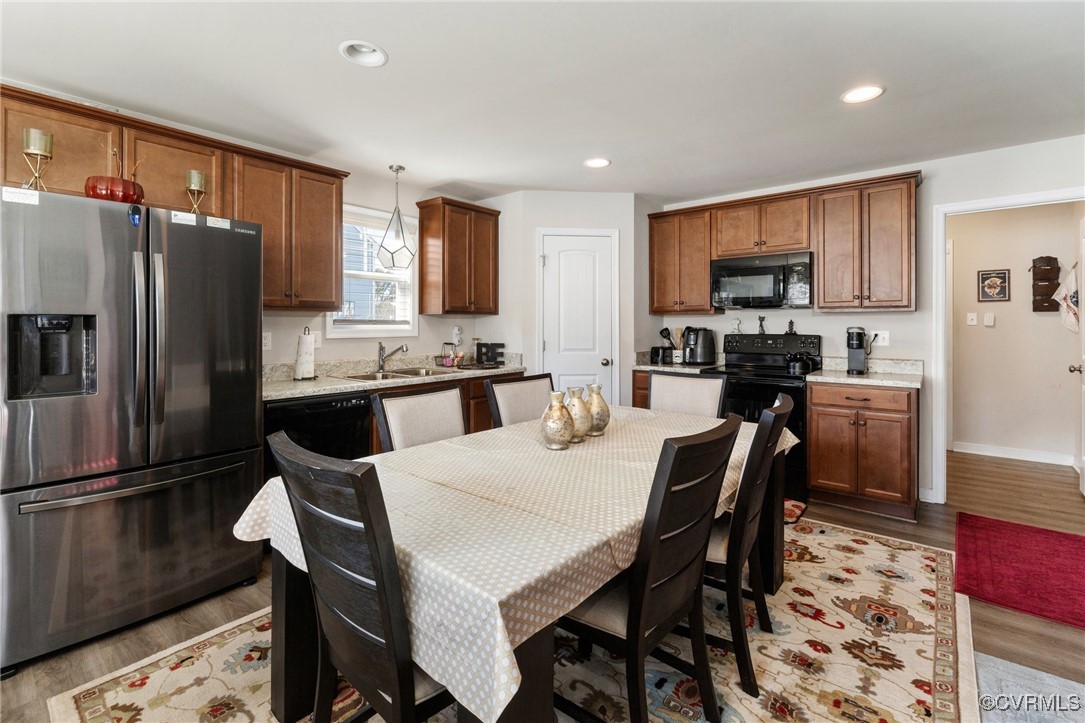 7313 Appelman Road Chesterfield, VA 23832 - Photo 11 of 21 Kitchen with sink, pendant lighting, light wood-ty