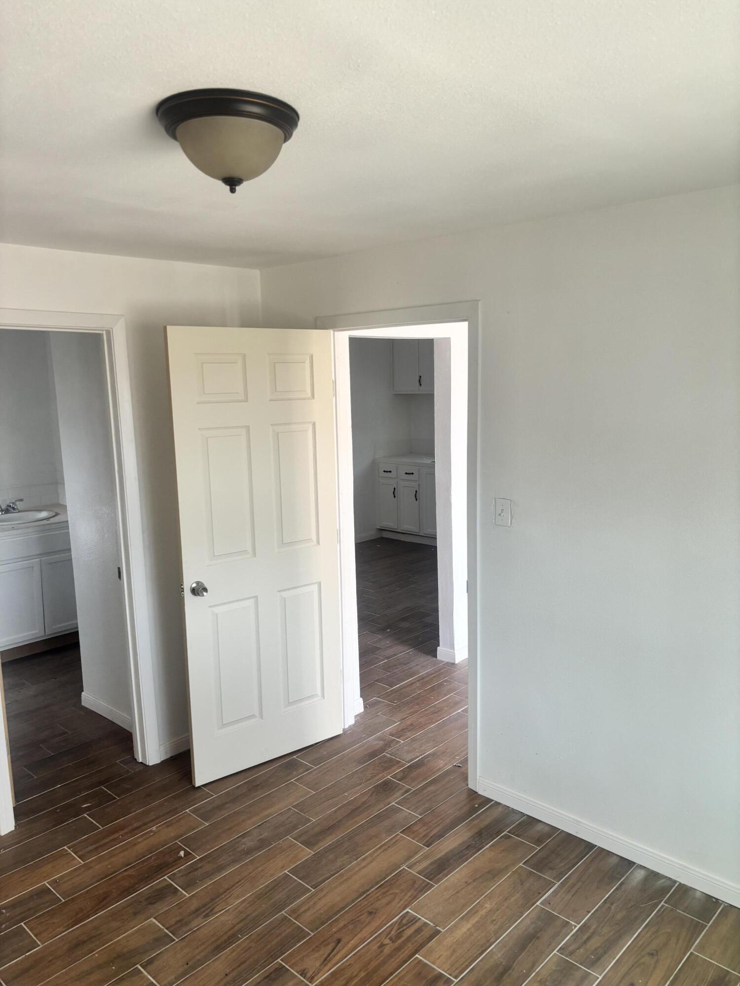 312 East 34th Street Lubbock, TX 79404 - Photo 12 of 25 a view of an empty room and wooden floor