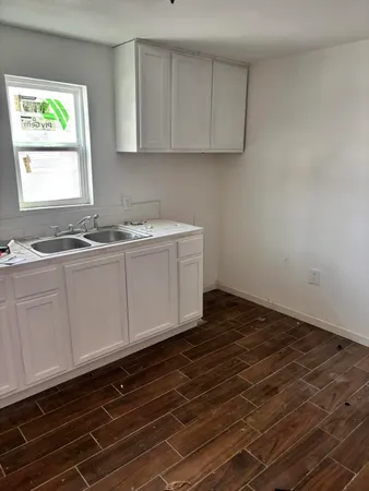 a kitchen with stainless steel appliances granite countertop a sink and a stove