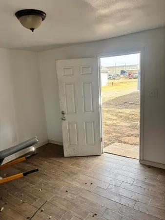 a view of an empty room and window