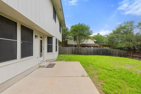 a view of backyard with green space