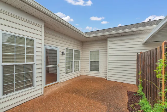 a view of an empty room with a balcony