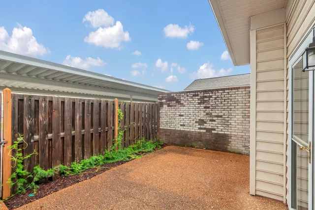 a view of an empty room with a balcony