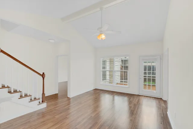 wooden floor in an empty room with a window