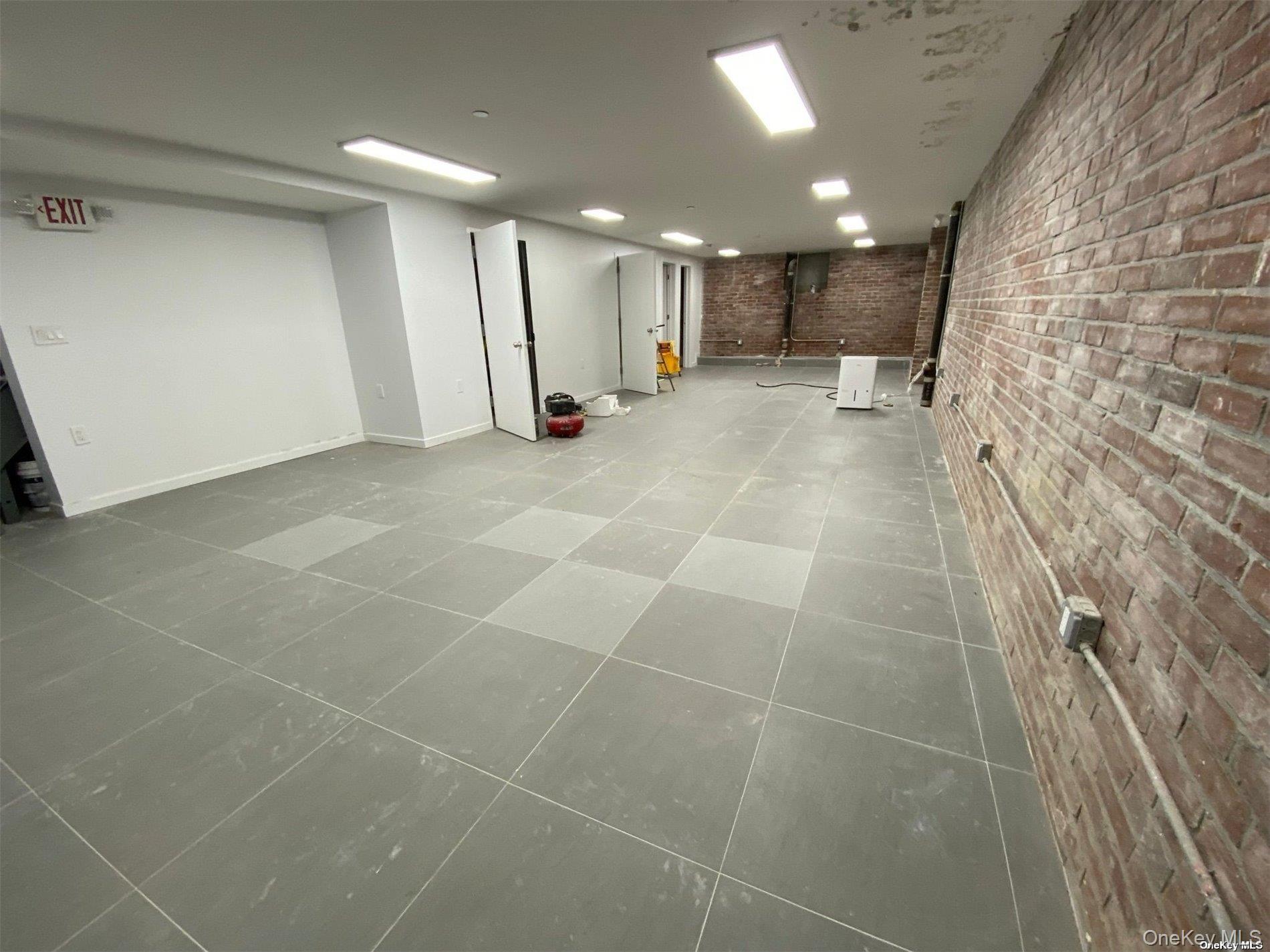 3043 Fulton Street Brooklyn, NY 11208 - Photo 9 of 14 a view of a hall with wooden floor