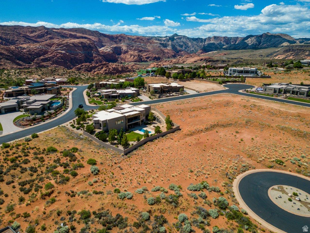 Basalt Cir Street, Unit 1027 St. George, UT 84770 - Photo 21 of 29 Aerial perspective of suburban area with a mountain backdrop