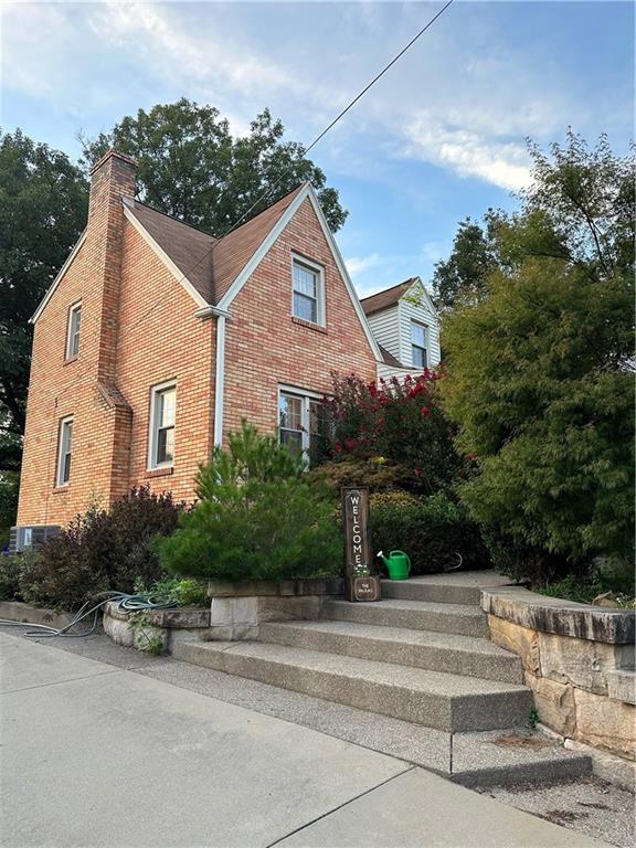 8585 Peebles Road Pittsburgh, PA 15237 - Photo 2 of 23 a front view of a house with a yard