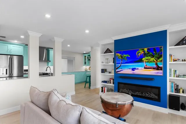 a living room with furniture and a fireplace